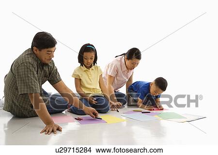 Picture - Parents sitting on floor with children. Fotosearch