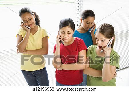 Preteen girls of multiple ethnicities talking on cell phones View Large Photo Image Stock Photo - Preteen girls of multiple ethnicities talking on cell phones. Fotosearch