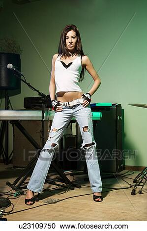 Female posing with musical equipment View Large Photo Image Stock Image - Female posing with musical equipment. Fotosearch