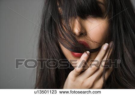 Headshot of pretty young woman with long black hair. View Large Photo Image Stock Image - Headshot of pretty young woman with long black hair.. Fotosearch