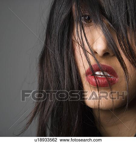 Stock Image - Woman with long black hair. Fotosearch