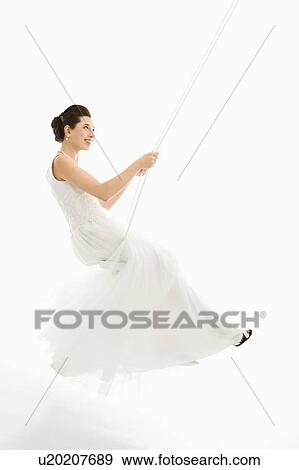 Asian bride swinging in swing set. View Large Photo Image Stock Photo - Asian bride swinging in swing set. . Fotosearch