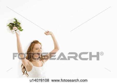 Stock Photo - Bride holding bouquet and raising arms. Fotosearch