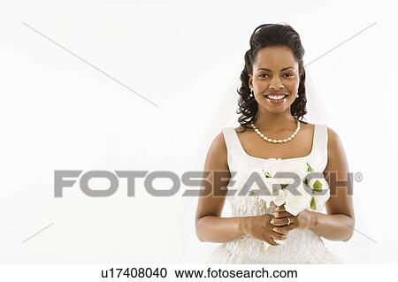 Stock Image - Bride holding bouquet on white background. Fotosearch