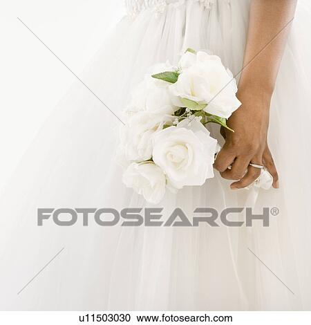 Bride holding bouquet View Large Photo Image Stock Image - Bride holding bouquet. Fotosearch