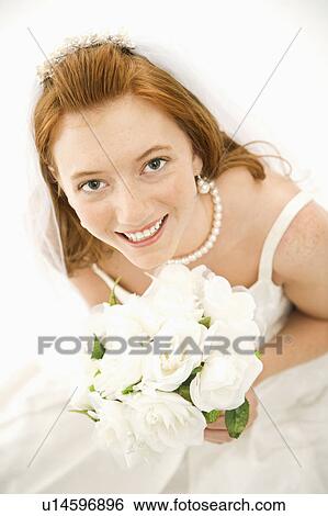Bride holding bouquet View Large Photo Image Stock Photograph - Bride holding bouquet. Fotosearch