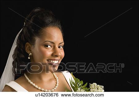Stock Photograph - Bride on black background. Fotosearch