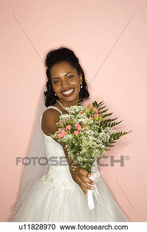 Stock Image - Bride on pink background. Fotosearch