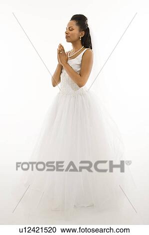 Stock Image - Bride praying. Fotosearch