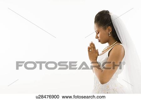 Stock Image - Bride praying. Fotosearch