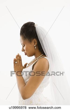 Bride praying with white background. View Large Photo Image Stock Photo - Bride praying with white background.. Fotosearch