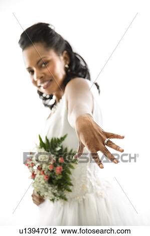 Stock Image - Bride showing ring. Fotosearch
