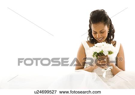 Stock Photo - Mid-adult bride on white background. Fotosearch