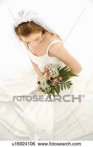 Portrait of a bride holding bouquet View Large Photo Image Stock Photograph - Portrait of a bride holding bouquet. Fotosearch
