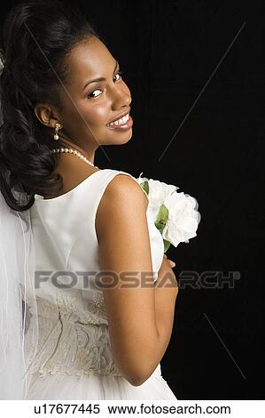 Stock Photography - Portrait of a bride on black background. Fotosearch