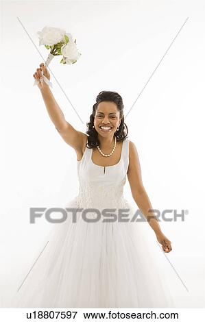 Stock Photo - Portrait of a mid-adult bride on white background. Fotosearch