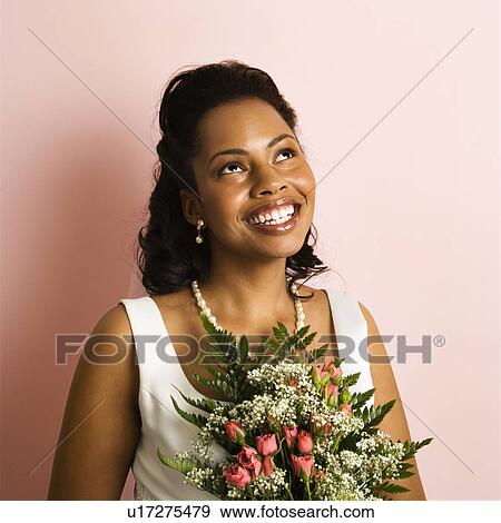 Portrait of a mid-adult African-American bride on pink background. View Large Photo Image Stock Photo - Portrait of a mid-adult African-American bride on pink background.. Fotosearch