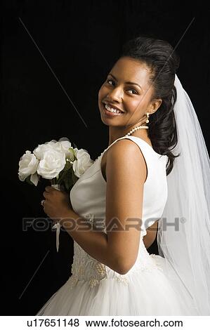 Portrait of a mid-adult African-American bride on black background. View Large Photo Image Stock Photo - Portrait of a mid-adult African-American bride on black background.. Fotosearch