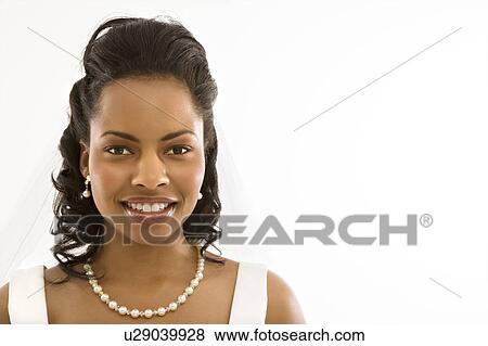 Portrait of a mid-adult African-American bride on white background. View Large Photo Image Stock Photo - Portrait of a mid-adult African-American bride on white background. . Fotosearch