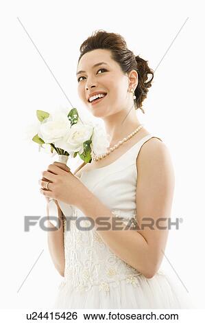 Stock Photograph - Portrait of bride with bouquet. Fotosearch