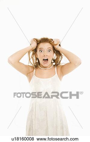 Portrait of Caucasian bride pulling her hair and making a stressful facial expression. View Large Photo Image Stock Photo - Portrait of Caucasian bride pulling her hair and making a stressful facial expression.. Fotosearch