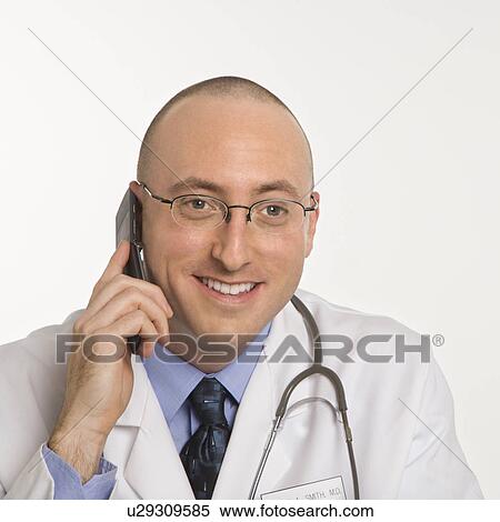 Caucasian mid adult male physician talking on cellphone. View Large Photo Image Stock Photography - Caucasian mid adult male physician talking on cellphone.. Fotosearch