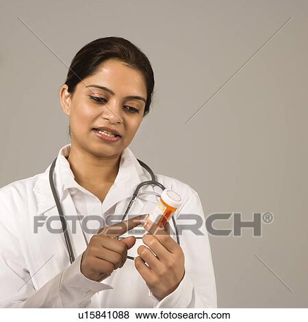 Stock Photo - Indian woman doctor explaining medication.. Fotosearch