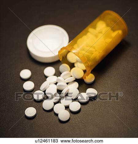 Open medicine bottle with pills spilling out onto table. View Large Photo Image Stock Image - Open medicine bottle with pills spilling out onto table.. Fotosearch