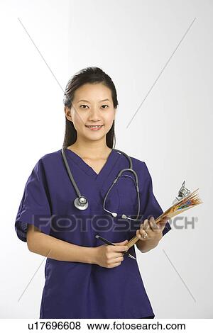 Portrait of Asian Chinese mid-adult female doctor smiling and looking at viewer. View Large Photo Image Stock Photo - Portrait of Asian Chinese mid-adult female doctor smiling and looking at viewer.. Fotosearch