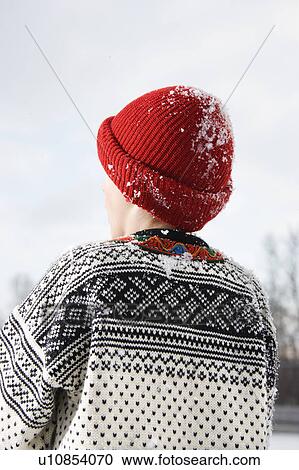 Back view of a boy wearing sweater and red winter cap View Large Photo Image Stock Image - Back view of a boy wearing sweater and red winter cap. Fotosearch