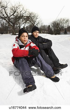 Boys sitting in snow View Large Photo Image Picture - Boys sitting in snow. Fotosearch