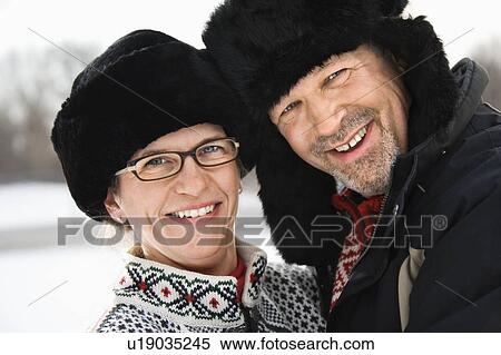 Stock Photography - Man and woman in winter clothing . Fotosearch