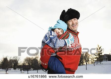 Portrait of Caucasian middle aged man holding Caucasian litte girl piggyback style smiling and looking at viewer. View Large Photo Image Stock Photograph - Portrait of Caucasian middle aged man holding Caucasian litte girl piggyback style smiling and looking at viewer.. Fotosearch