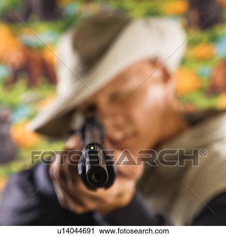 Male pointing a rifle at viewer View Large Photo Image Stock Image - Male pointing a rifle at viewer . Fotosearch