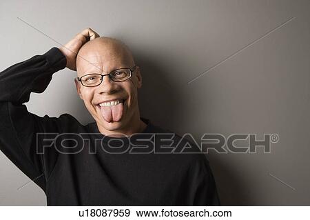 Stock Photo - Male sticking out tongue. Fotosearch