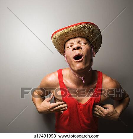 Male wearing hat and touching his chest View Large Photo Image Stock Image - Male wearing hat and touching his chest. Fotosearch
