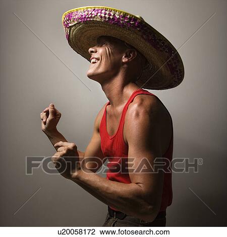 Stock Image - Male wearing sombrero snapping fingers. Fotosearch