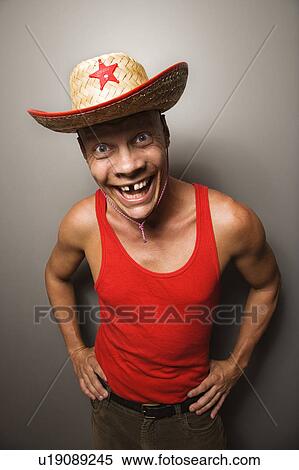 Stock Photography - Male wearing straw hat. Fotosearch