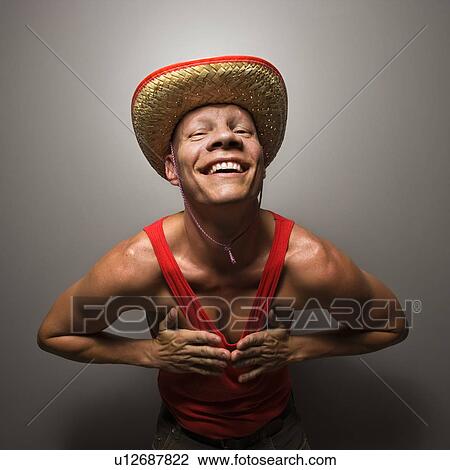 Male wearing stray hat and touching his chest View Large Photo Image Stock Image - Male wearing stray hat and touching his chest. Fotosearch