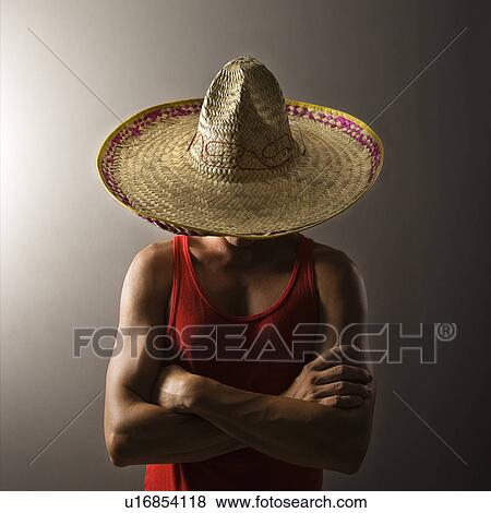 Portrait of a Mid-adult Caucasian male wearing sombrero holding maracas. View Large Photo Image Stock Photo - Portrait of a Mid-adult Caucasian male wearing sombrero holding maracas.. Fotosearch