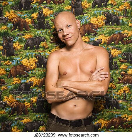 Stock Photo - Portrait of a shirtless Mid-adult Caucasian male.. Fotosearch