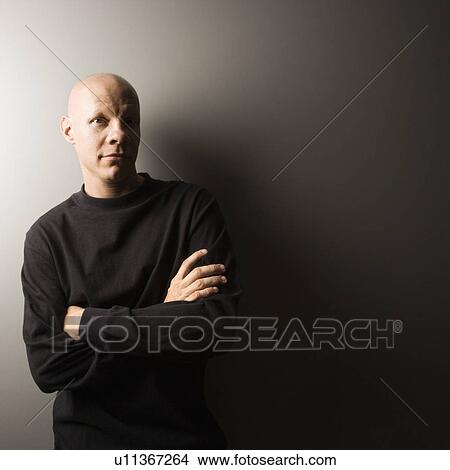 Picture - Portrait of mid-adult Caucasian male with arms crossed.. Fotosearch