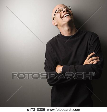 Portrait of mid-adult Caucasian male with crossed arms. View Large Photo Image Stock Photograph - Portrait of mid-adult Caucasian male with crossed arms.. Fotosearch