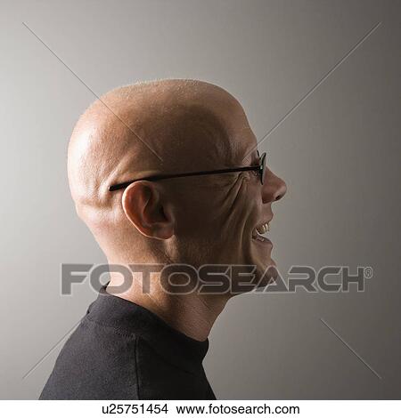 Profile portrait of mid-adult Caucasian male smiling. View Large Photo Image Picture - Profile portrait of mid-adult Caucasian male smiling.. Fotosearch