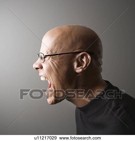 Profile portrait of mid-adult male screaming View Large Photo Image Stock Photo - Profile portrait of mid-adult male screaming. Fotosearch