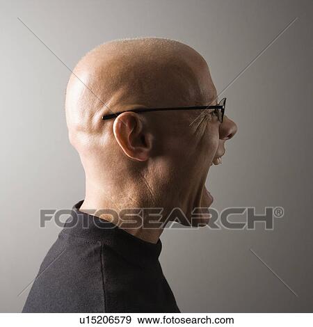 Profile portrait of mid-adult male screaming View Large Photo Image Stock Photo - Profile portrait of mid-adult male screaming. Fotosearch