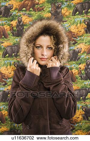 Caucasian young adult woman wearing coat with fur hood looking at viewer. View Large Photo Image Stock Image - Caucasian young adult woman wearing coat with fur hood looking at viewer.. Fotosearch