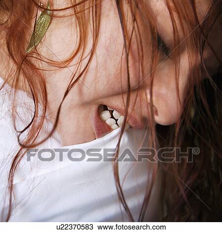 Close up of pretty young redhead woman biting pillow. View Large Photo Image Stock Image - Close up of pretty young redhead woman biting pillow.. Fotosearch