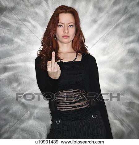Portrait of pretty young redhead woman giving middle finger gesture. View Large Photo Image Stock Photo - Portrait of pretty young redhead woman giving middle finger gesture.. Fotosearch