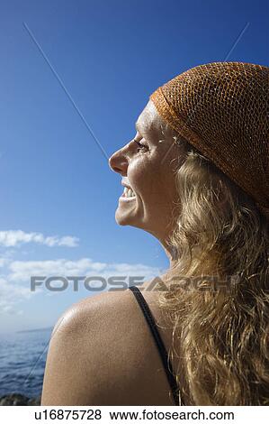 Woman with wavy hair and head scarf at coast View Large Photo Image Stock Photo - Woman with wavy hair and head scarf at coast. Fotosearch